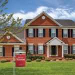 Brick home being sold during the coronavirus pandemic. Should you buy a home during a pandemic?