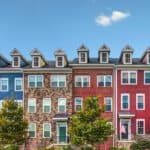 Row of townhomes with a clear blue sky
